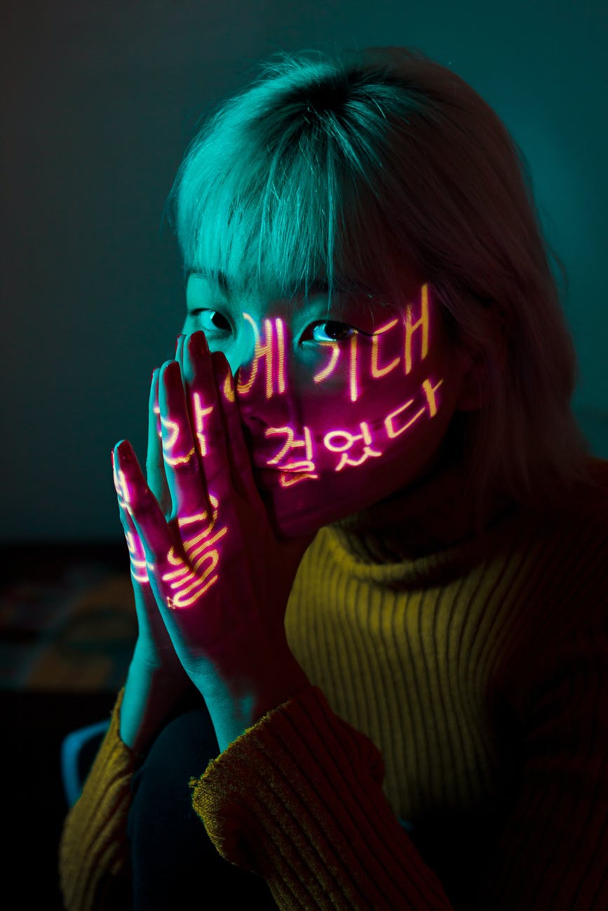 photo of woman wearing yellow sweater