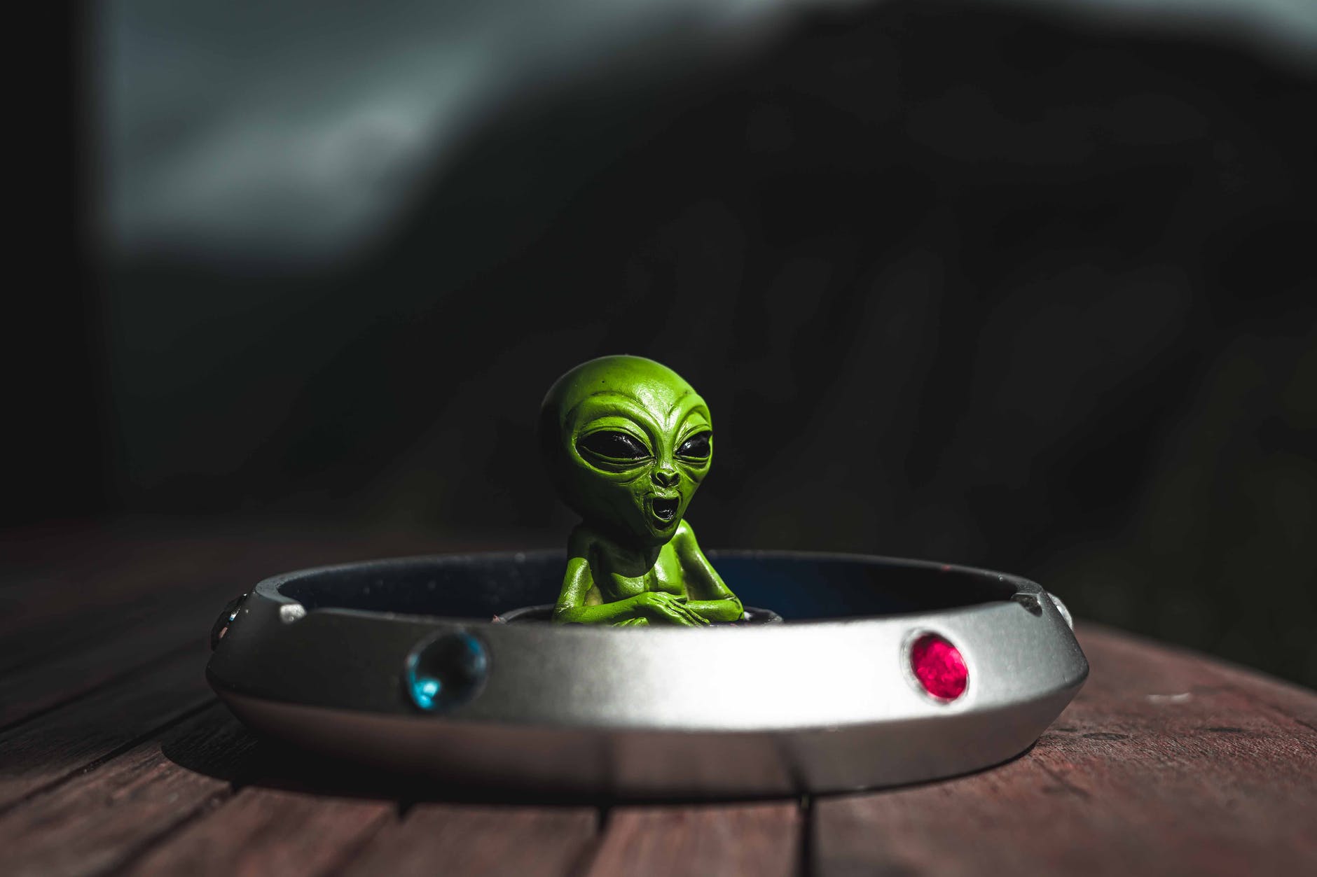 ashtray with an alien toy inside